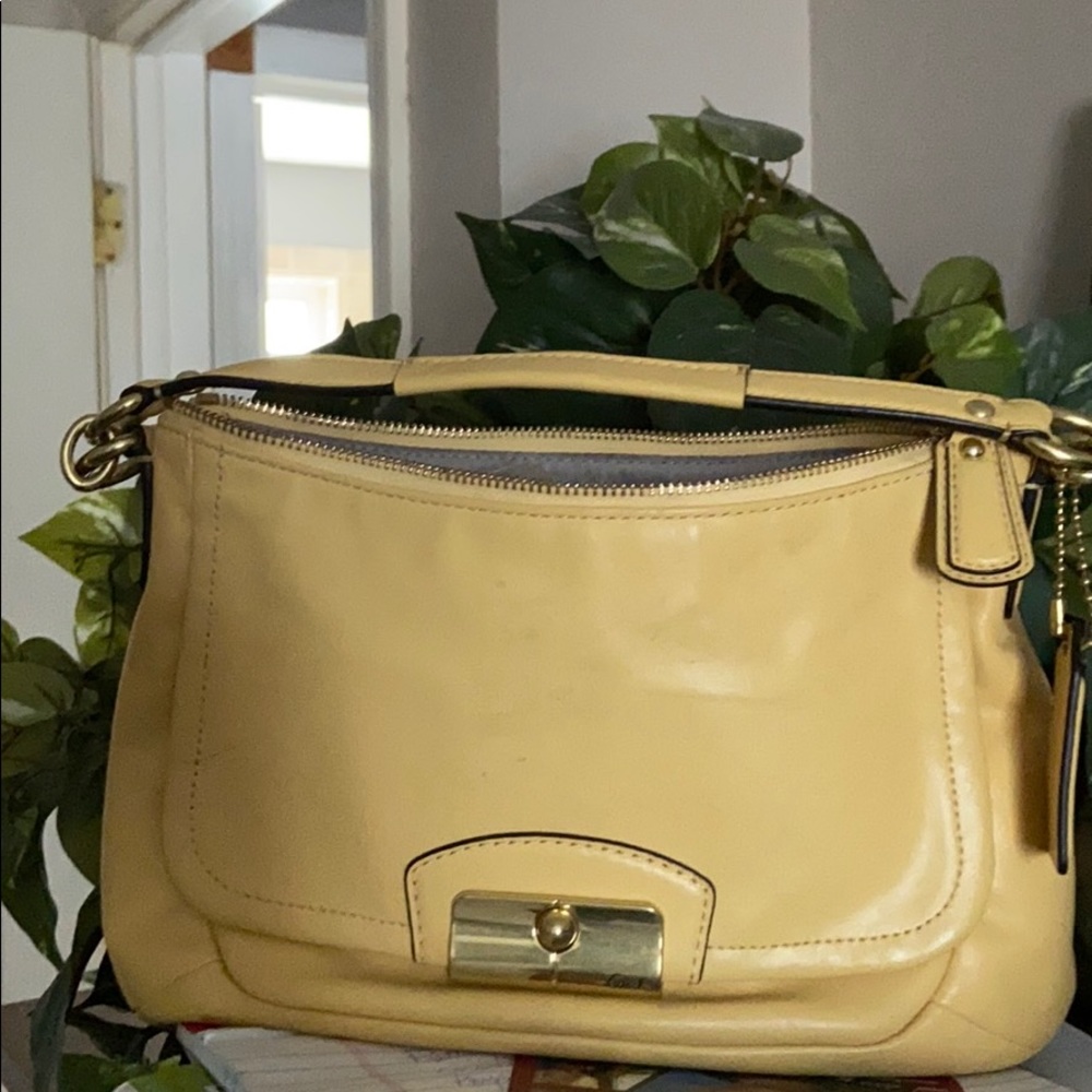 Coach sunflower color soft leather hand bag.